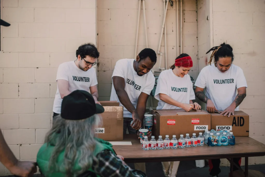 Volunteer opening food boxes