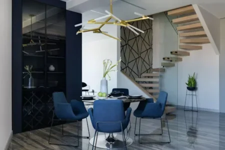 a dining table with blue chairs