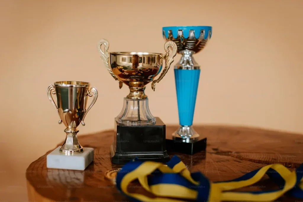 Crafting Custom Trophies: Celebrating Achievements with Personal Flair a group of trophies sitting on top of table