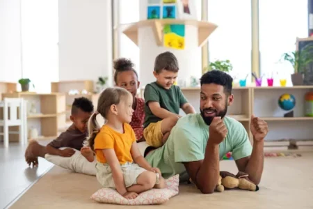a man playing with children