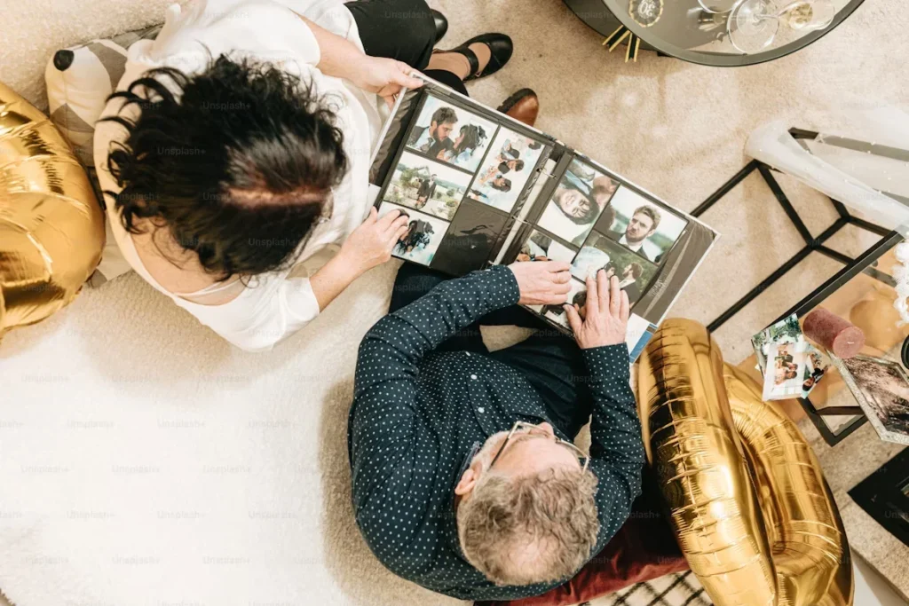 a oouple looking at a photo album