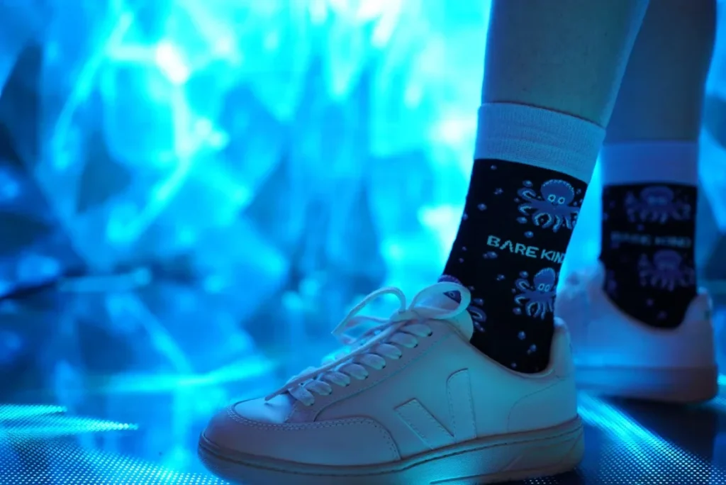 Why Crew Socks Are a Wardrobe Essential for All a pair of white sneakers with black and white socks