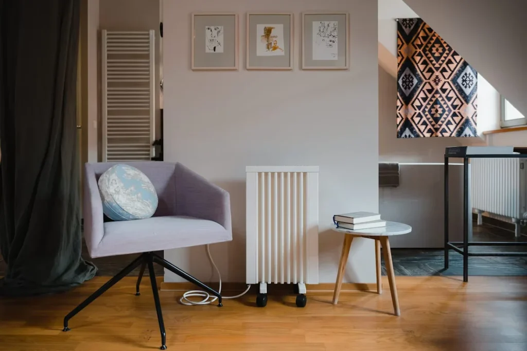 Radiator Placement Tips for Maximum Warmth a room with chair and table