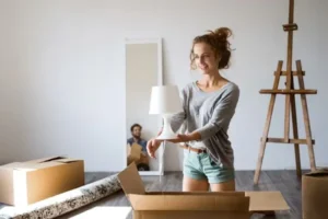 a woman holding lamp in her hands