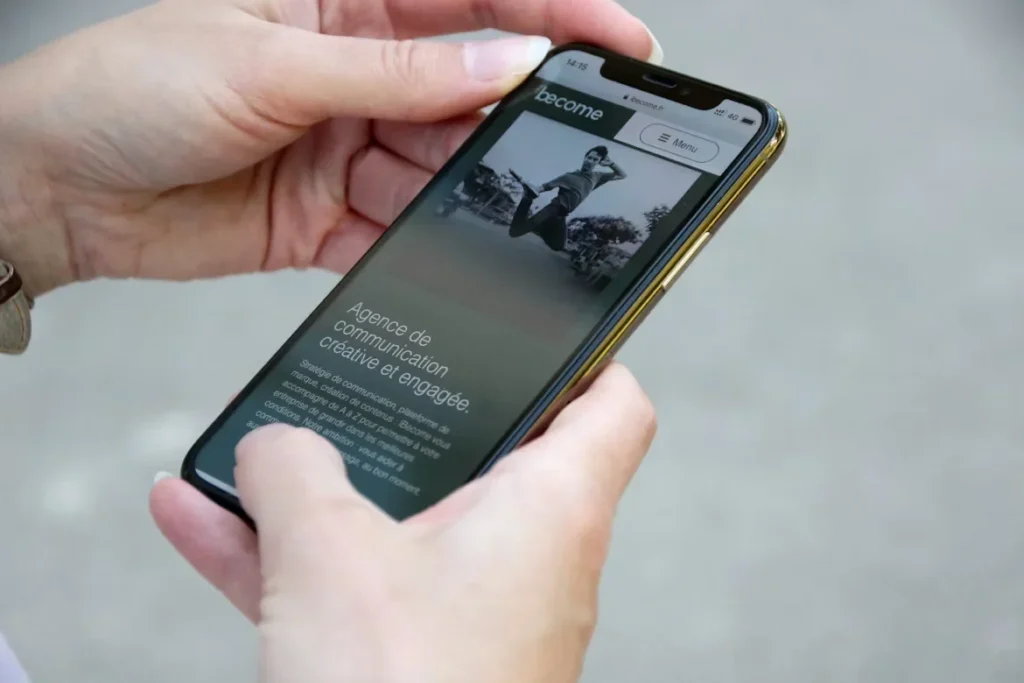 5 Web Design Secrets That Convert Visitors Into Customers person holding mobile phone
