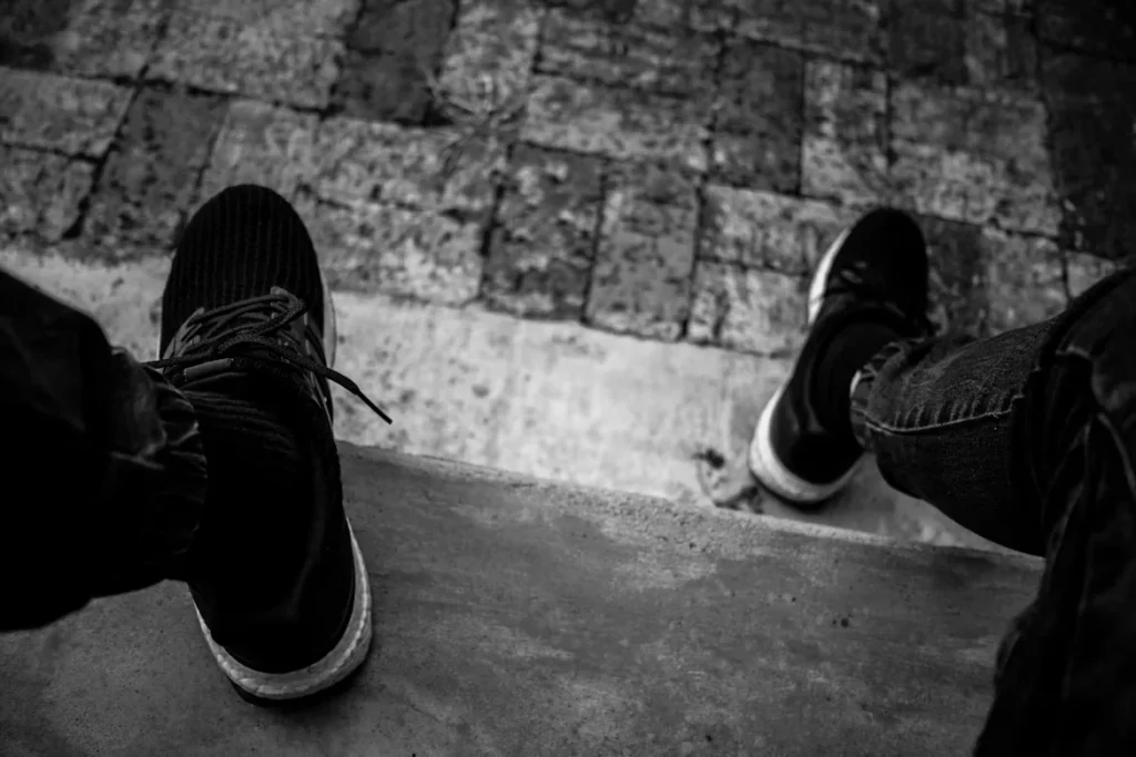 Non-Slip vs Slip-Resistant Shoes: Why the Difference Matters A person wearing black shoes