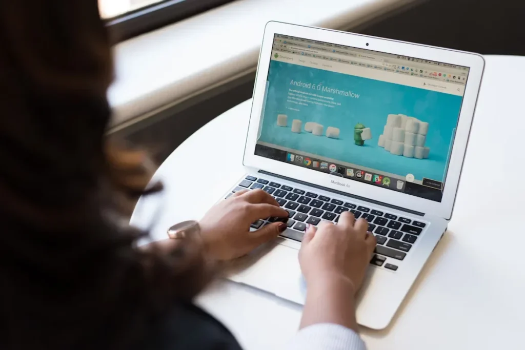 5 Web Design Secrets That Convert Visitors Into Customers woman using macbook