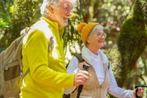 Two elderly people hiking
