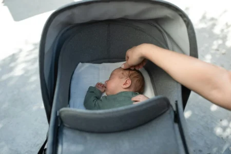 Pram Liner: Comfort and Style for Your Baby’s Ride a baby sleeping in stoler