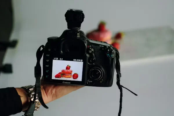a person clicking picture of food