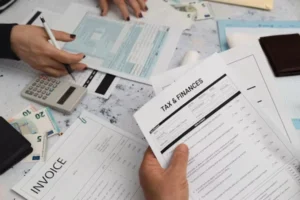 a person holding papers in hand