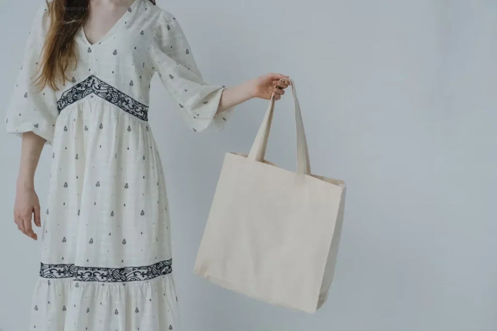5 Low-Cost Ideas for Lasting Impressions a woman holding tote bag