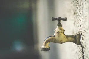 Brass faucets with water droplets