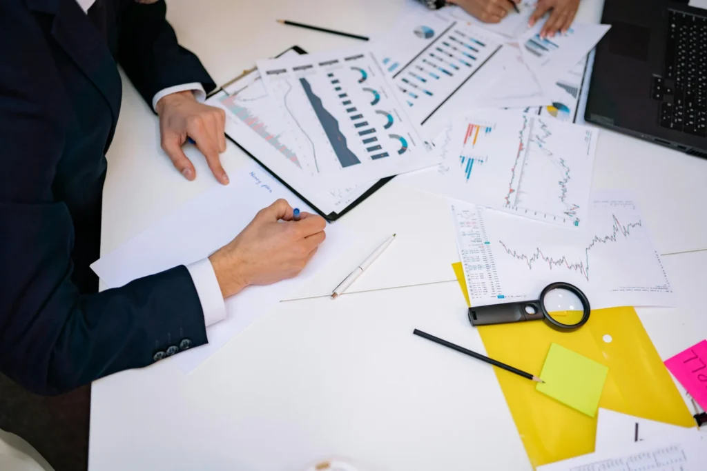 The Role of Financial Leaders in Business Growth a person writing on paper 1