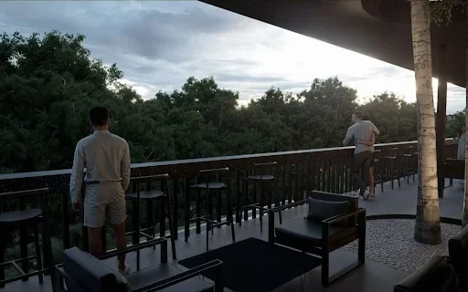 two men standing on tarrece