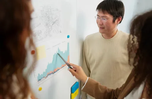 people standing in fornt of board