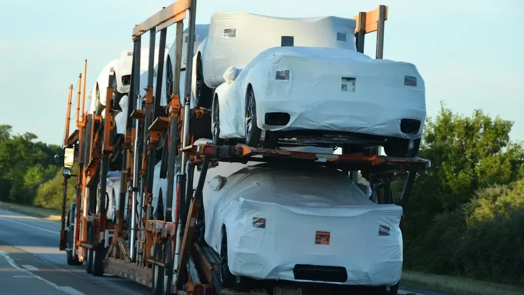 a truck witha bunch of cars on it.