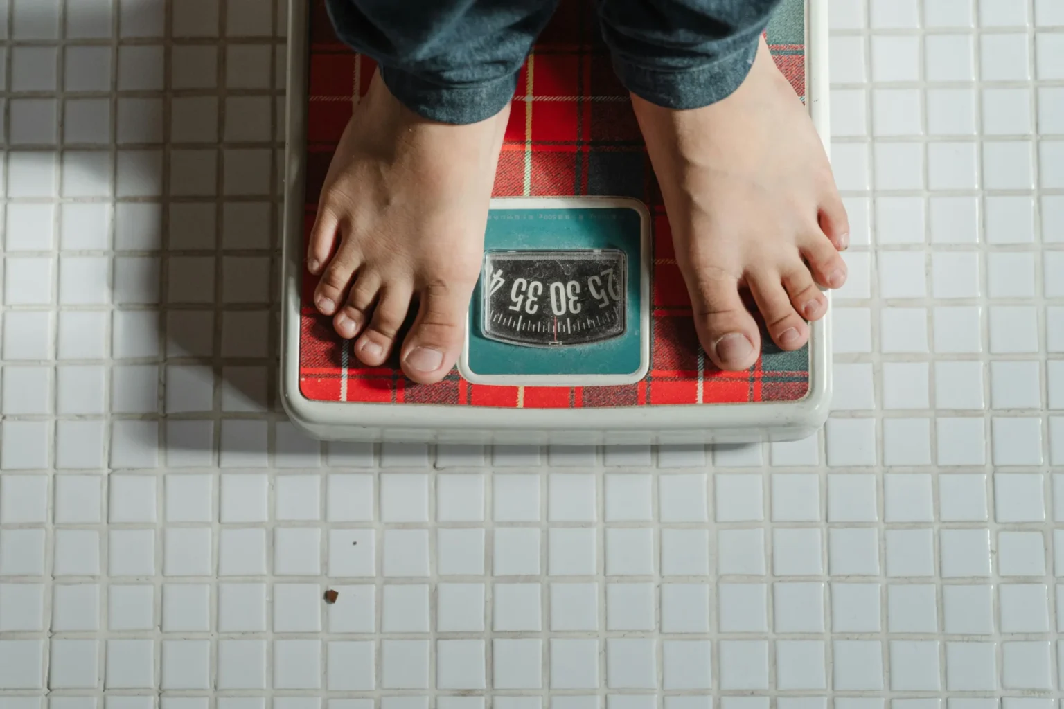 a person standing on weighing machine