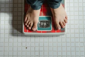 a person standing on weighing machine