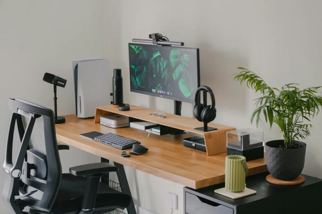 a computer desk with a monitor