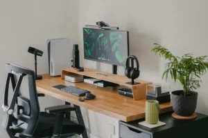 a computer desk with a monitor