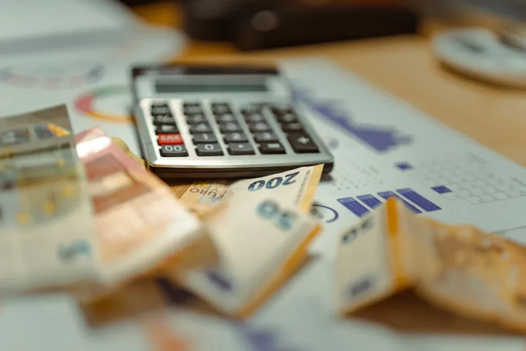 calculator and money on table