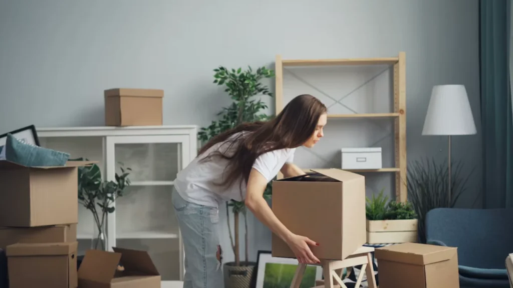 How to Organize a Move in Berkeley: A Complete Guide a woman picking up a box